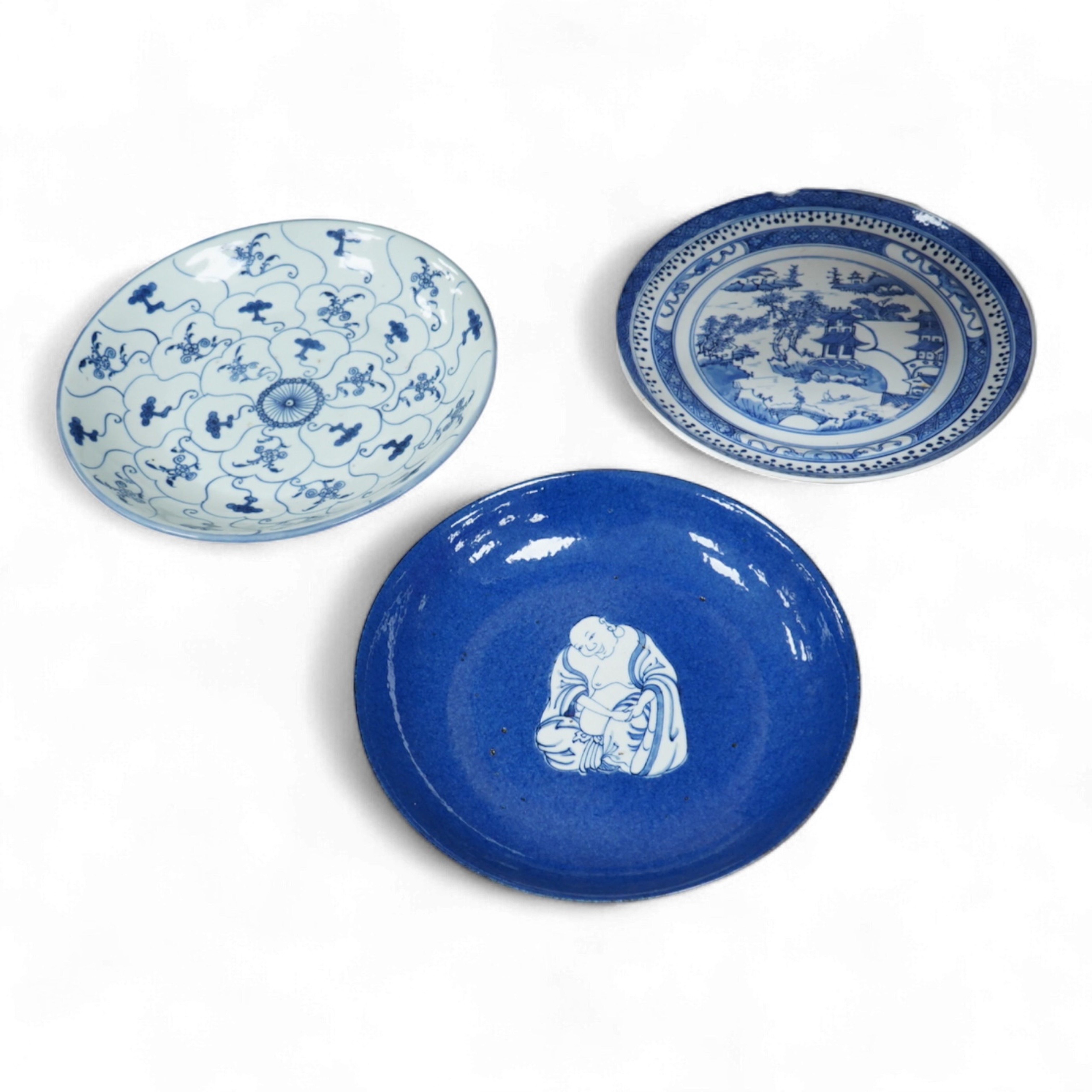 Three Chinese blue and white plates, largest 26cm